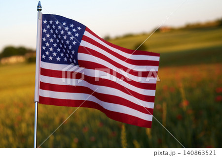 American flag waving in a rural field American flag waving in a rural field 140863521