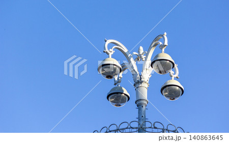 Electric street lamp on blue sky background 140863645