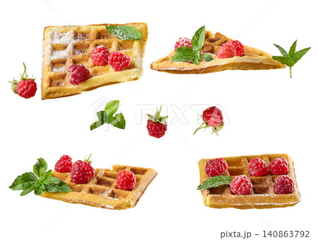 Belgian waffles with raspberries, mint and sprinkled with powdered sugar Belgian waffles with raspberries, mint and sprinkled with powdered sugar 140863792