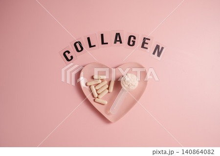 Collagen capsules and powder in heart shaped dish with collagen lettering Collagen capsules and powder in heart shaped dish with collagen lettering 140864082