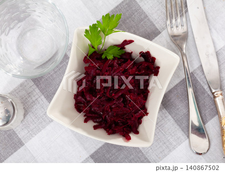 Popular russian salad, made from boiled grated beetroot, decorated with herbs Popular russian salad, made from boiled grated beetroot, decorated with herbs 140867502