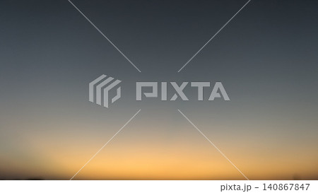 A beautiful minimal dawn sky scene capturing the subtle transitions of soft color gradients at dawn. The clear light of the horizon shifts from moody blue to warm bright orange, offering an elegant A beautiful minimal dawn sky scene capturing the subtle transitions of soft color gradients at dawn. The clear light of the horizon shifts from moody blue to warm bright orange, offering an elegant 140867847