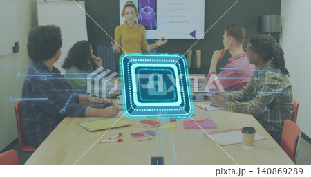 Presenting woman in mustard sweater gesturing at table in meeting room, with holographic padlock 140869289