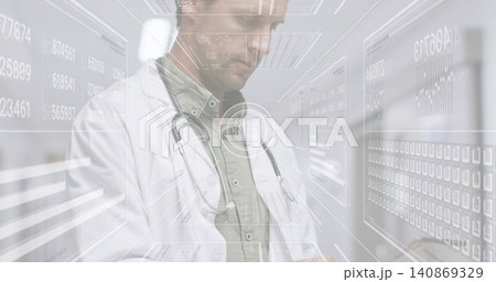 Examining physician interacting with holographic panels in corridor, white coat and stethoscope Examining physician interacting with holographic panels in corridor, white coat and stethoscope 140869329
