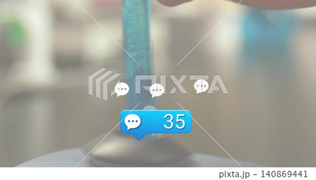 Displaying blue chat notification bubble showing 35 with clear rod and suction base on desk, bokeh 140869441