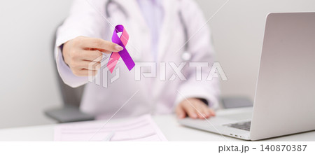 Doctor giving purple and pink ribbon to patient for concept of September Thyroid Cancer Awareness month, Healthcare and February world cancer day 140870387
