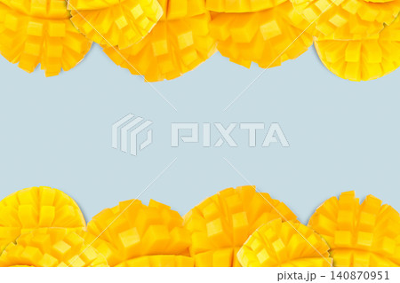 Colorful mango slices frame a bright backdrop for creative advertising Colorful mango slices frame a bright backdrop for creative advertising 140870951