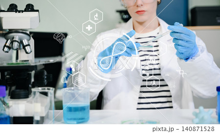 A senior female scientist analyzes clinical data using a futuristic digital HUD graphics interface in a high-tech biotechnology laboratory. A senior female scientist analyzes clinical data using a futuristic digital HUD graphics interface in a high-tech biotechnology laboratory. 140871528