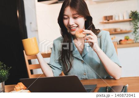 Happiness Entrepreneur beautiful business asian young woman wear casual use mobile phone for shopping online enjoy with social media and laptop at home.Small Business Startup.online banking Happiness Entrepreneur beautiful business asian young woman wear casual use mobile phone for shopping online enjoy with social media and laptop at home.Small Business Startup.online banking 140872041
