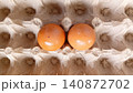 Close up of two fresh eggs in a tray. 140872702
