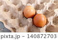 Close up of two fresh eggs in a tray. 140872703