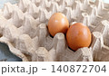 Close up of two fresh eggs in a tray. 140872704