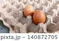 Close up of two fresh eggs in a tray. 140872705