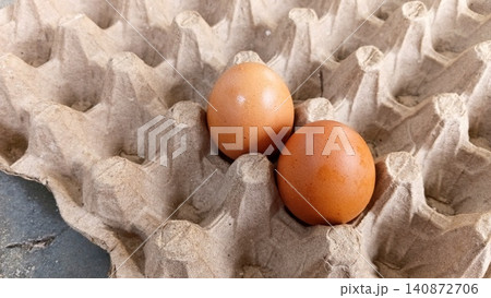 Close up of two fresh eggs in a tray. 140872706
