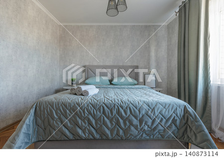 Modern Residential Bedroom Interior with Made Double Bed Modern Residential Bedroom Interior with Made Double Bed 140873114