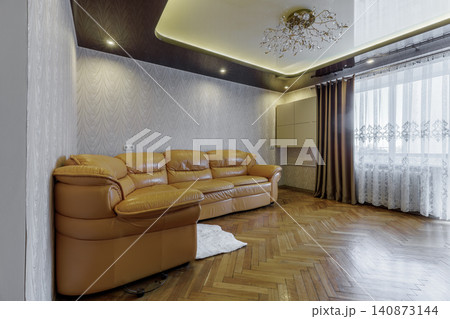 Bright Apartment Living Room Interior with Window and Leather Sofa Bright Apartment Living Room Interior with Window and Leather Sofa 140873144