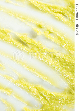 Creative strokes and smears of healthy guacamole sauce isolated on white backdrop Creative strokes and smears of healthy guacamole sauce isolated on white backdrop 140873441