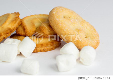Danish butter cookies and marshmallows on a white background. Close-up. Danish butter cookies and marshmallows on a white background. Close-up. 140874273