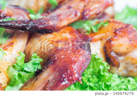 Fried chicken wings with herbs. Close-up. 140874279