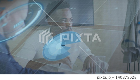 Holding pen, man in white shirt studying documents at conference table with holographic overlays Holding pen, man in white shirt studying documents at conference table with holographic overlays 140875628