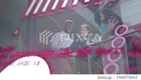 Reading three colleagues examining open folders on mezzanine in business casual with pink overlay 140875642