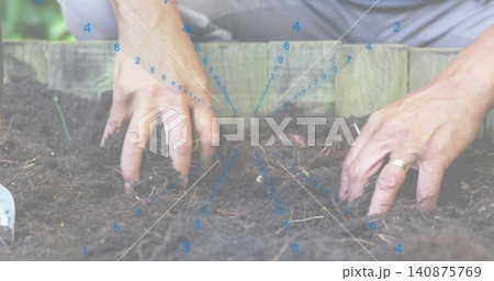 Sifting senior man's bare hands working in raised garden bed, with trowel, gold ring, blue overlay Sifting senior man's bare hands working in raised garden bed, with trowel, gold ring, blue overlay 140875769