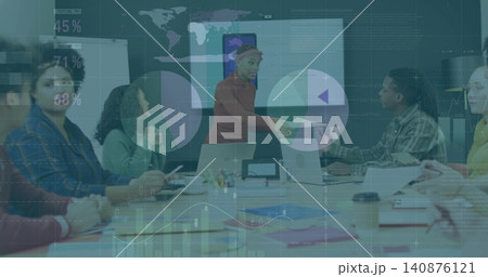Presenting presenter in red sweater, extending document in boardroom with laptops and pie charts Presenting presenter in red sweater, extending document in boardroom with laptops and pie charts 140876121