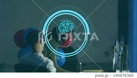 Working pair in office tan-sweater white top leaning at desk reviewing with AI overlay and balloons 140876360