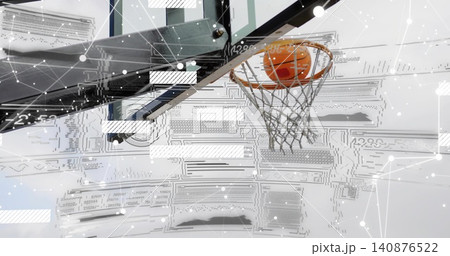 Passing orange basketball through rim and backboard in gym near arm, vent, overlay, copy space 140876522