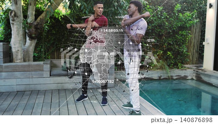 Stretching two men wearing casual clothing on grey wooden pool deck, with holographic globe overlay Stretching two men wearing casual clothing on grey wooden pool deck, with holographic globe overlay 140876898