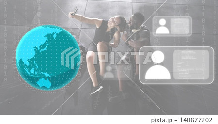 Taking selfie couple wearing black dress and T-shirt, holding phone in lobby with AR globe Taking selfie couple wearing black dress and T-shirt, holding phone in lobby with AR globe 140877202
