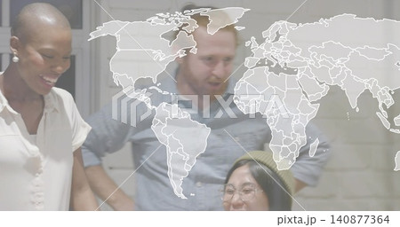 Leaning team smiling, looking down in office, wearing olive beanie, glasses, world map overlay Leaning team smiling, looking down in office, wearing olive beanie, glasses, world map overlay 140877364