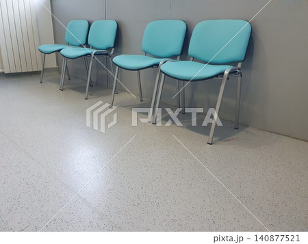 Robin egg blue chairs in hospital waiting room 140877521
