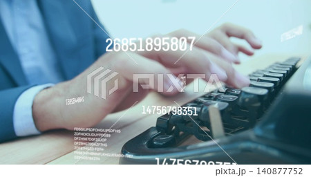 Typing hands in dark suit blue shirt pressing typewriter keys on wood desk, with digital overlays Typing hands in dark suit blue shirt pressing typewriter keys on wood desk, with digital overlays 140877752