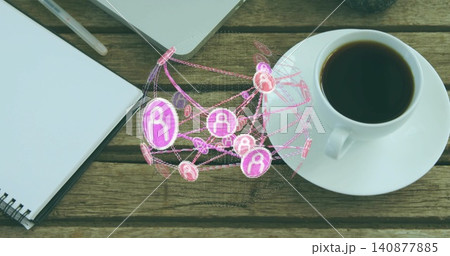 Projecting digital pink-purple 3D network globe above wood table, showing notebook, laptop, coffee 140877885