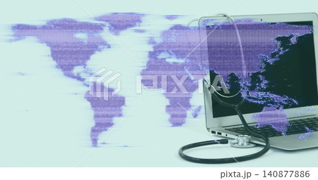 Showing silver laptop draped with black stethoscope on right table, purple map overlay, copy space 140877886
