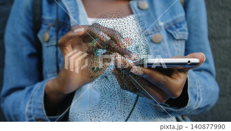 Tapping woman in denim jacket holding white phone in room, showing translucent mesh overlay Tapping woman in denim jacket holding white phone in room, showing translucent mesh overlay 140877990