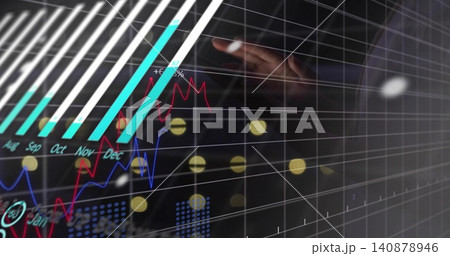 Reaching right hand in dark sleeve touching clear touchscreen at desk, cyan bars +6%, copy space 140878946
