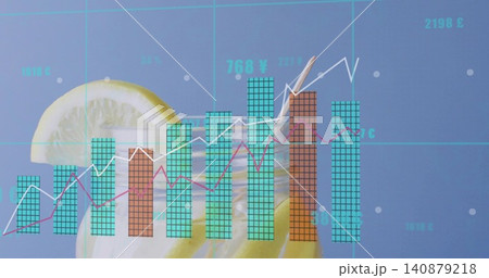 Blending tall glass and financial overlay in studio, with lemon slices, teal bars, magenta lines 140879218