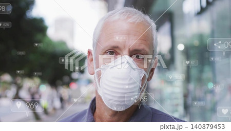 Standing man wearing N95 mask, collared shirt facing camera at city street, with digital overlays 140879453