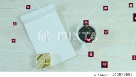 Showing top-bound notepad left on wood desk with gift-box, coffee-mug, purple-icons, yellow-lines Showing top-bound notepad left on wood desk with gift-box, coffee-mug, purple-icons, yellow-lines 140879695