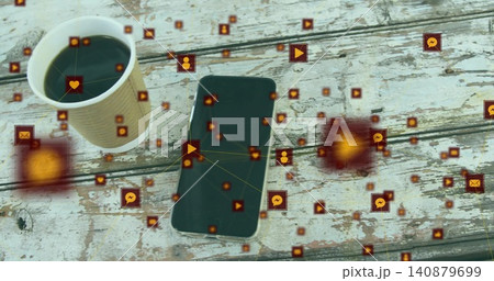 Showing smartphone featuring floating icons and glowing nodes on rustic cafe table with coffee cup Showing smartphone featuring floating icons and glowing nodes on rustic cafe table with coffee cup 140879699