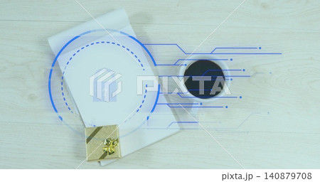 Displaying closed white notebook bearing blue lock overlay on light wood desk, gold gift and coffee 140879708