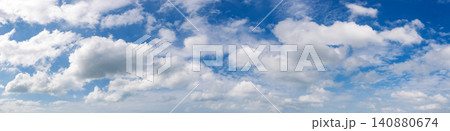 Wide angle panorama of beautiful sky with cumulus clouds  over a clear horizon. 140880674
