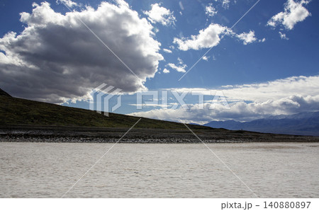 Explore Death Valley Salt Flats Under a Blue Sky Filled With Clouds 140880897