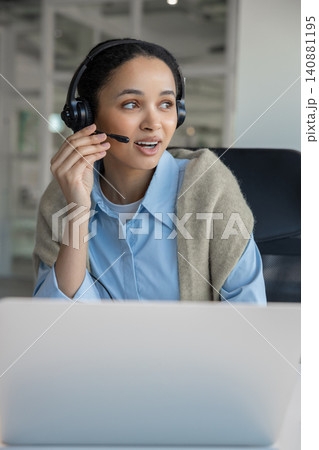 Consultant adjusting microphone looking away 140881195