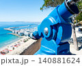 Tourist Viewing Telescope Overlooking Harbor and Sea 140881624