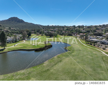 Aerial view of Ramona neighborhood with mountain, valley and golf course 140881635