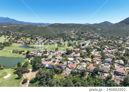 Aerial view of Ramona neighborhood with mountain, valley and golf course 140882001