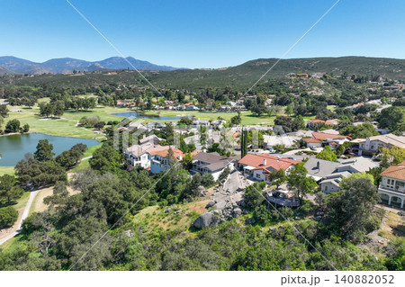 Aerial view of Ramona neighborhood with mountain, valley and golf course 140882052